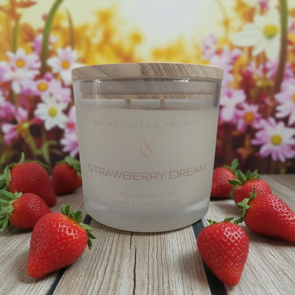 Candle labeled 'Strawberry Dream' with strawberries and a floral background
